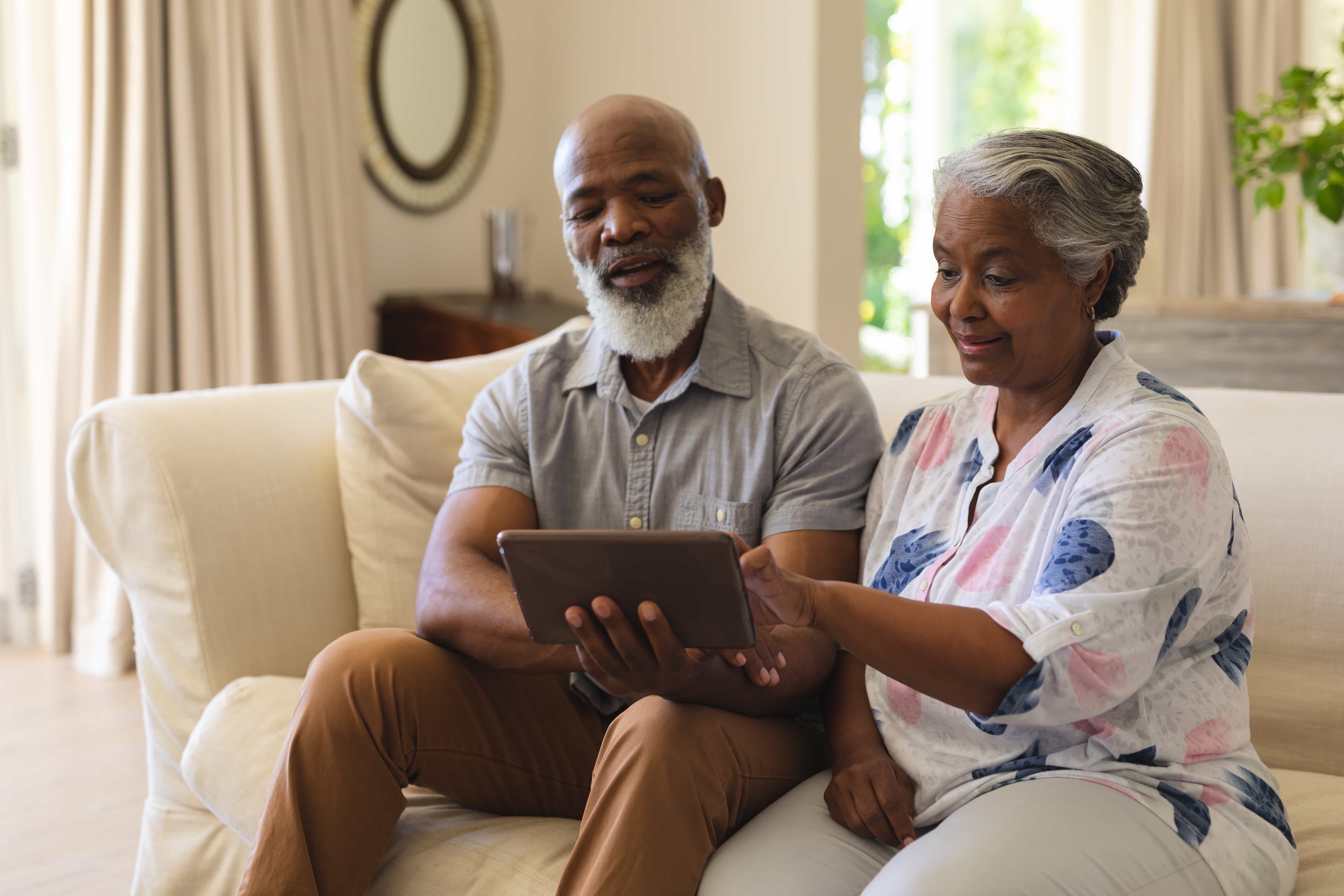 A couple using yourpharmacist.co on a tablet